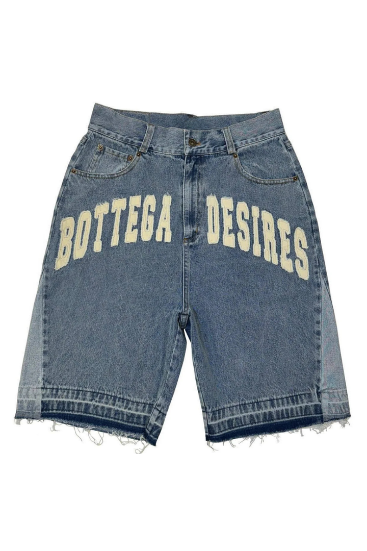 Blue denim shorts with 'Bottega Desires' text on a white background